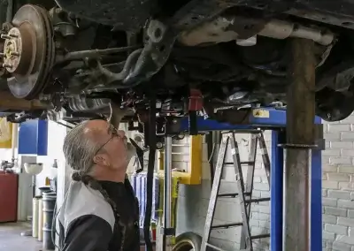 Hawkins Automotive Technician inspects vehicle
